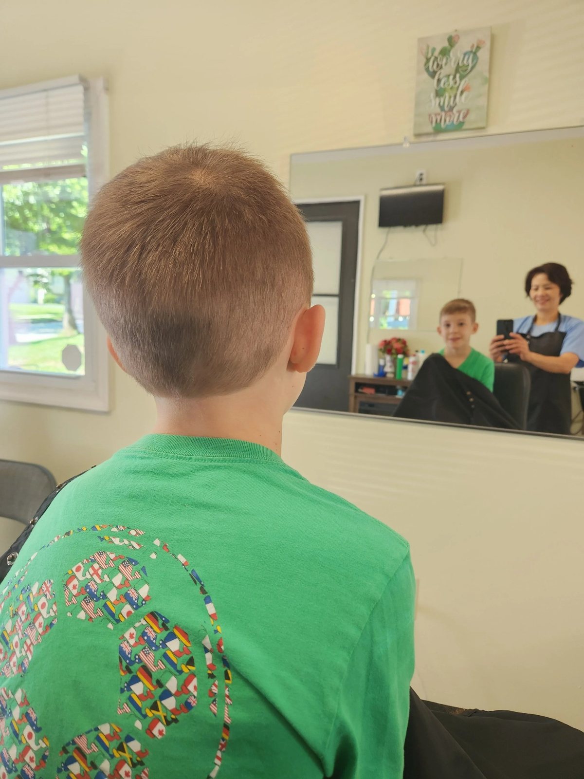 Blonde bob haircut side profile at Happy Barber