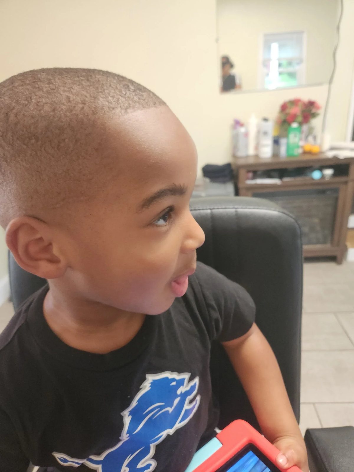 Kid's buzz cut side view at Happy Barber