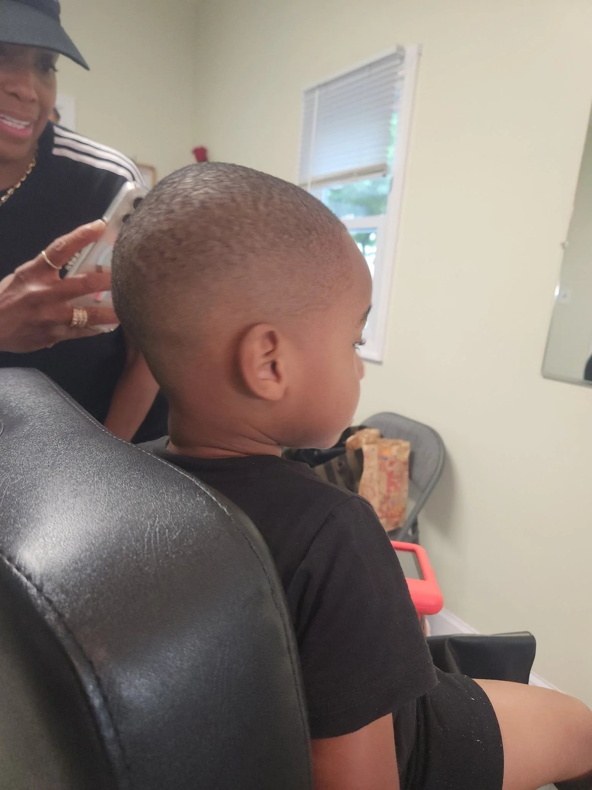 Longer men's haircut back view at Happy Barber
