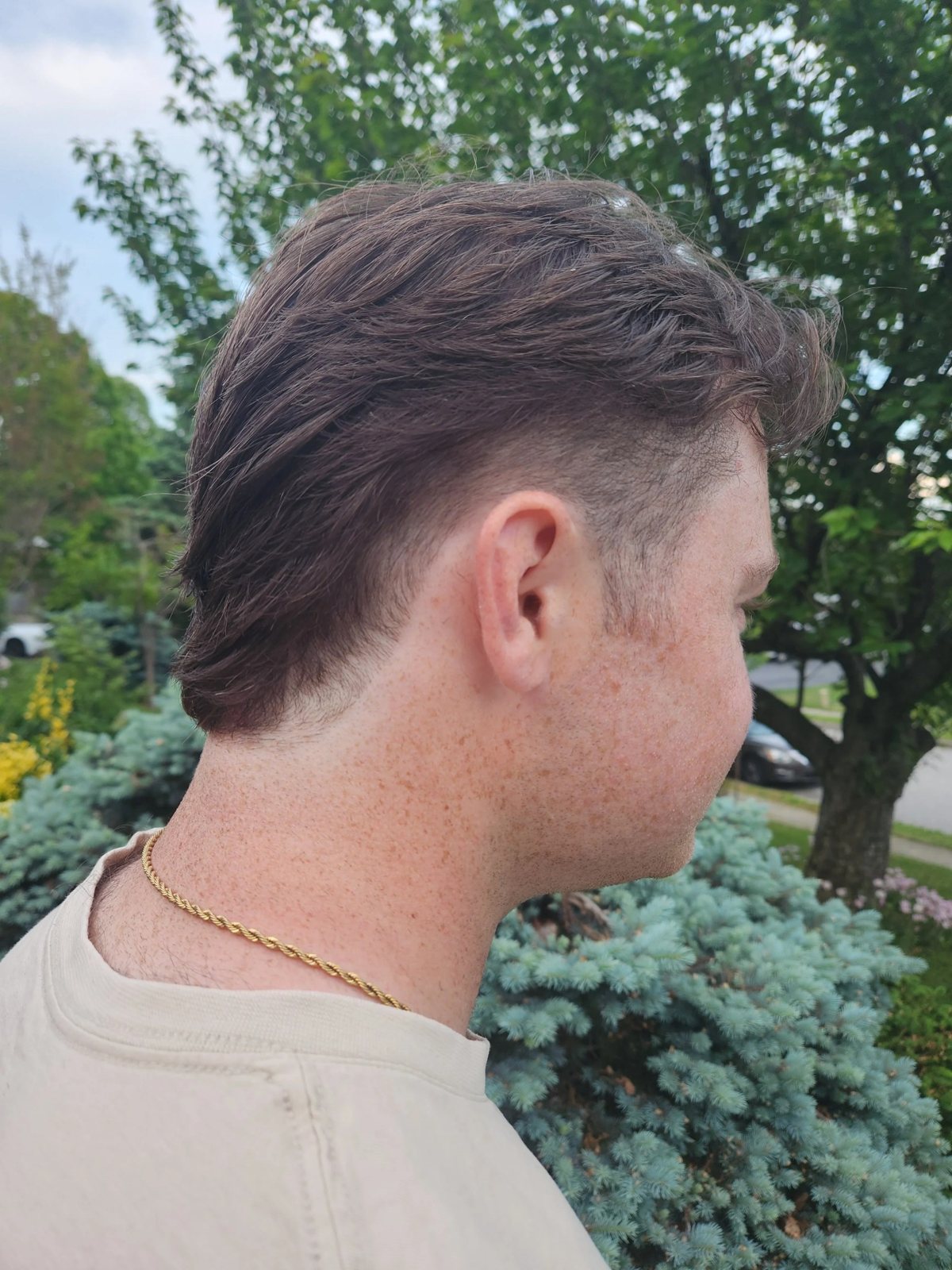 Short fade haircut back view at Happy Barber