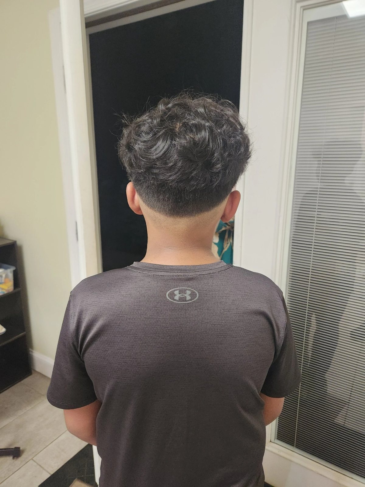 Tight fade with glasses at Happy Barber